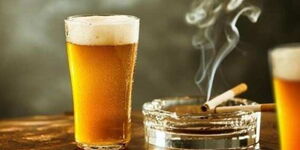 Alcoholic drinks and a burning cigarette 