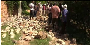 A screen grab showing residents looking at the section of a perimeter wall that was brought down to create the feeder road in Malindi on June 12, 2023.