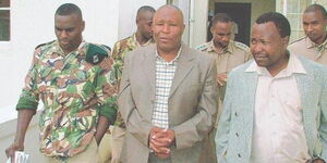 The late tycoon Gilbert Njoroge, famously known as Fai Amario, (center) heading to court in 2005.