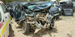 A wrecked car that had been boarded by the three missionaries.