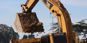 An excavator carries out a road project in Kenya.