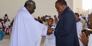 Archbishop Philip Anyolo and President Kenyatta at Marian Shrine in Subukia on February 22, 2020.