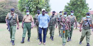 President William Ruto with Kenyan police officers at Karen home during his tenure as Deputy President.