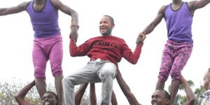 Embakasi East MP Babu Owino with an acrobatics troupe during a routine on September 11, 2020.