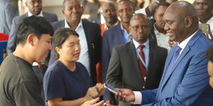 Immigration PS Julius Bitok interacts with travellers at JKIA in January 2024