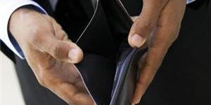 A man holding an empty wallet.