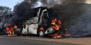 A bus catches fire during a journey along a highway in Kenya.