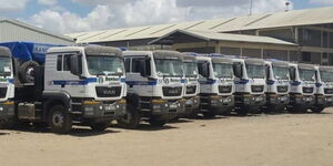 A photo of parked trucks belonging to Buzeki Group of Companies.