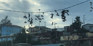 Dangling Shoes Hanging on Power Lines Inside Kibera. Undated.