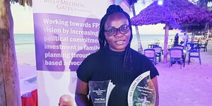 TV 47 health reporter Violet Auma poses after getting second place at the AFP Awards 2021 held in Ukunda, Kwale County.  