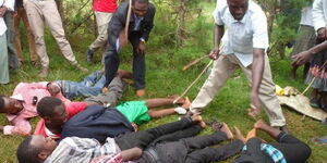 File Photo of Students Being Caned Following an Indiscipline Incident