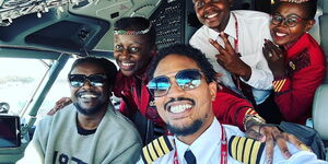 Captain Fred Malu (right) poses for a photo alongside Kenyan-based artist Nyashinski on July 5, 2023.