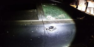 A vehicle sprayed with bullets by armed suspects on Wednesday night, April 21