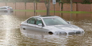 A car partially submerged in flood waters