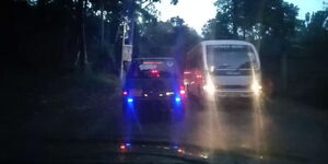 Motorists moving in Nairobi with blue blinking lights 