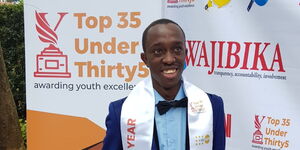 Kenyan Chess Sportsman James Kang'aru Mwangu with his award at the International Youth Week