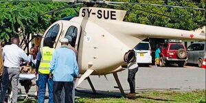  Nurses assisting expectant woman into the chopper at Sericho village, Isiolo County on Tuesday, April 19, 2023.