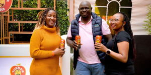 Tusker Cider Brand Manager Brigid Wambua, Eabl Commercial Director Joel Kamau and Senior Brand Manager, KBL, Zipporah Ndung’u pose for a photo at the Blankets and Wine festival held at the Laureate Gardens at Moi Sports Centre Kasarani on April 7, 2024. 
