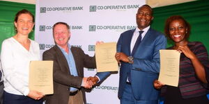 From the left: Conen Henreyer ( Agro Potato Services Africa), Steve Carlyon (President Simplifine), Dr Kiarie Moses N. Badilisha ( Nyandarua County Governor) and Esther Kariuki ( Head of Agri Cooperative at Co-op Bank) displaying an MOU after signing on March 7, 2023.  