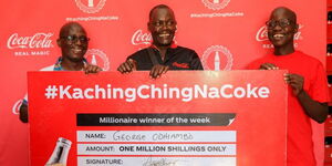 Coca-Cola Kenya, Area Sales Manager, Walter Omondi(left) poses alongside winner, George Odhiambo (centre) and his friend Joshua Opiyo (right) during the awarding ceremony in Homabay County. Odhiambo, a woven bag seller (Popularly known as Uhuru Bag), is the 3rd winner of the KES 1 million weekly grand prize in the ongoing ‘Kachingching na Coke’ promotion by Coca-Cola Kenya. This marks the continuing series of winnings as Coca-Cola will be awarding a total of 13 millionaires in the coming weeks.
