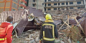 Rescue workers at the site of the collapsed building in Kasarani on November 15, 2022.