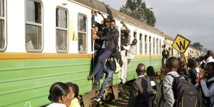 Commuters scramble to board a train at Mutindwa terminal in Umoja, Nairobi in this photo taken on November 5, 2018 .