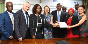 The DEG-led Consortium and Co-op Bank teams after sign-off of the $100 Million financing agreement. (L-R) Wilfred Apunda - Senior Investment Manager DEG, Michael Fischer - Director Financial Institutions Africa at DEG, Caroline Karimi – Director Finance & Strategy Co-op Bank, Monika Beck - Member of DEG’s Management Board, Dr Gideon Muriuki - Group Managing Director & CEO Co-op Bank, Judy Kinyanjui – Investment Director Norfund and Antje Steiner – Regional Director East Africa at KfW DEG. Partly hidden at t