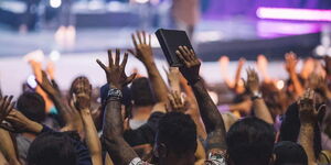 A stock photo of a church congregation worshiping