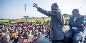 CS Murkomen atop a vehicle addressing residents at Londiani Junction in Kericho on July 1, 2023