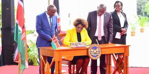 Water CS Alice Wahome signing a performance contract at State House, Nairobi on Wednesday, August 2, 2023.
