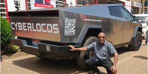 A Kenyan strikes a pose beside the Tesla Cybertruck in Mombasa, Kenya, on January 13, 2026