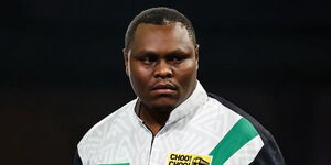 David Munyua celebrates during his debut match at the 2026 PDC World Darts Championship in Alexandra Palace, London, on December 18, 2025.