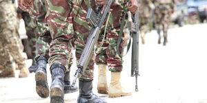 Police officers during a patrol on a road in Kajiado County in November 2023.