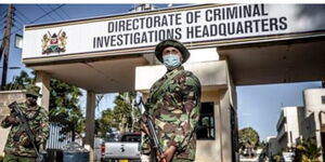 A photo of a police officer manning the DCI headquarters along Kiambu Road