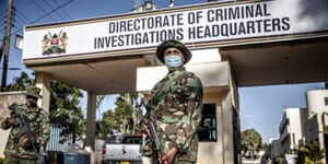 A police officer guards DCI Headquarters along Kiambu Road