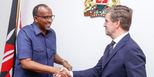 Defence CS Aden Duale (left) shaking hands with the Ambassador of Denmark in Kenya Stephen Schonemann (right) on Tuesday February 13, 2024