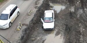 A vehicle that has plunged in the ditch on Mombasa road
