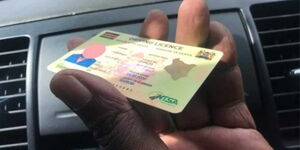 A motorist holding their driving licence
