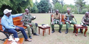 Deputy President William Ruto having tea with AP officers attached to his Karen residence