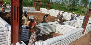 Builders constructing a house in Kenya using earthbags as posted on Wednesday, July 12th