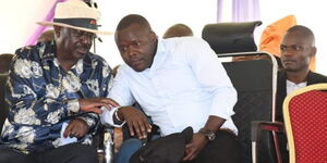 Azimio Leader Raila Odinga (left) conversing with Migori Senator Eddy Oketch (right) during a past function.
