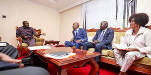 Education CS Ezekiel Machogu (second left), PS Belio Kipsang (second right) and TSC CEO Nancy Macharia (right) present KCSE results to President William Ruto.