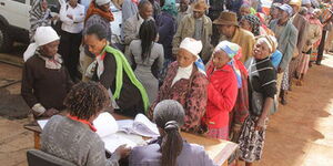 The elderly queuing for cash payments under the social protection programme.