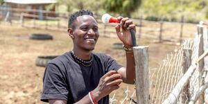 Entrepreneur Richard Turere with one of the lights from his organisation