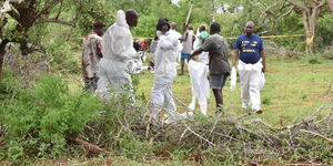 Health officers and detectives jointly exhuming bodies from mass graves in Kilifi County.
