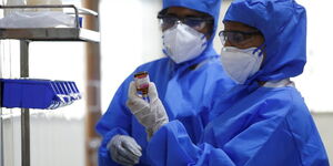 Stock photo of scientists in Wuhan China conducting tests to combat the Coronavirus outbreak.