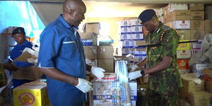 Police inside illicit alcohol store in Murang'a County