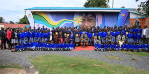 First Lady Margaret Kenyatta poses for a photo alongside pupils from St Kizito Litein School for the Deaf in Kericho County on Wednesday, June 8.