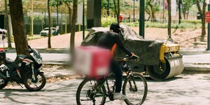 File photo of a cyclist delivering food ordered online