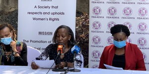 FIDA Chairperson Nancy Ikinu and fellow members at a press briefing